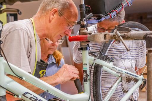 People working on bike
